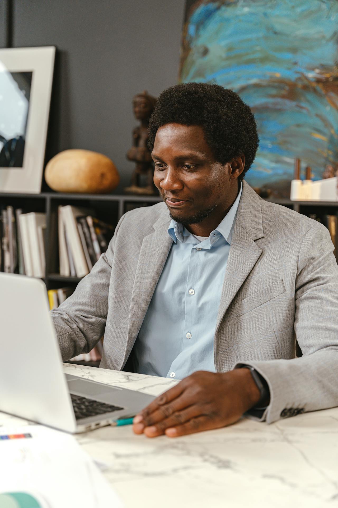 Black seller using smartphone for business